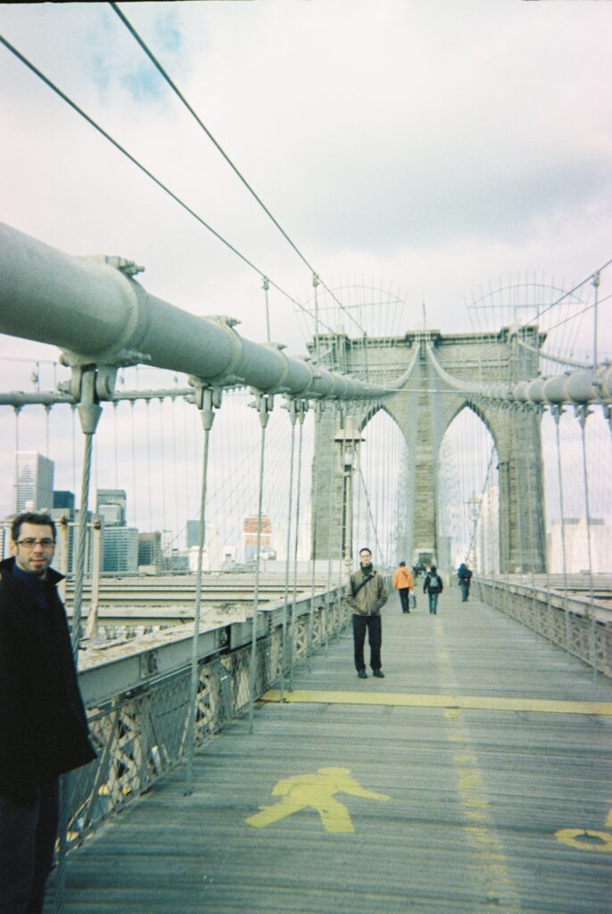 Joel Barker and Matt Flaming standing on a New York bridge